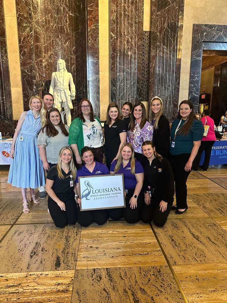 LSHA members gathered in the Louisiana State Capitol rotunda holding the LSHA pelican sign at Day at the Capitol.